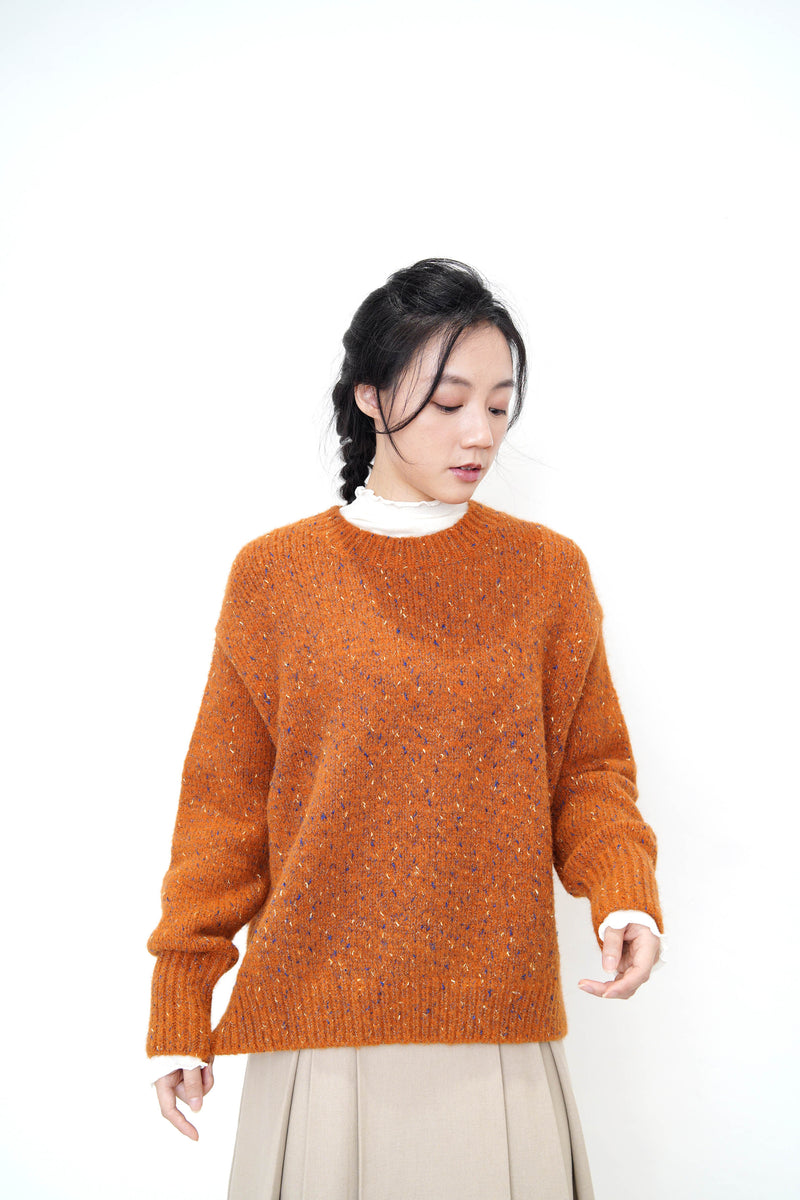 Orange tone sweater in stepped hem