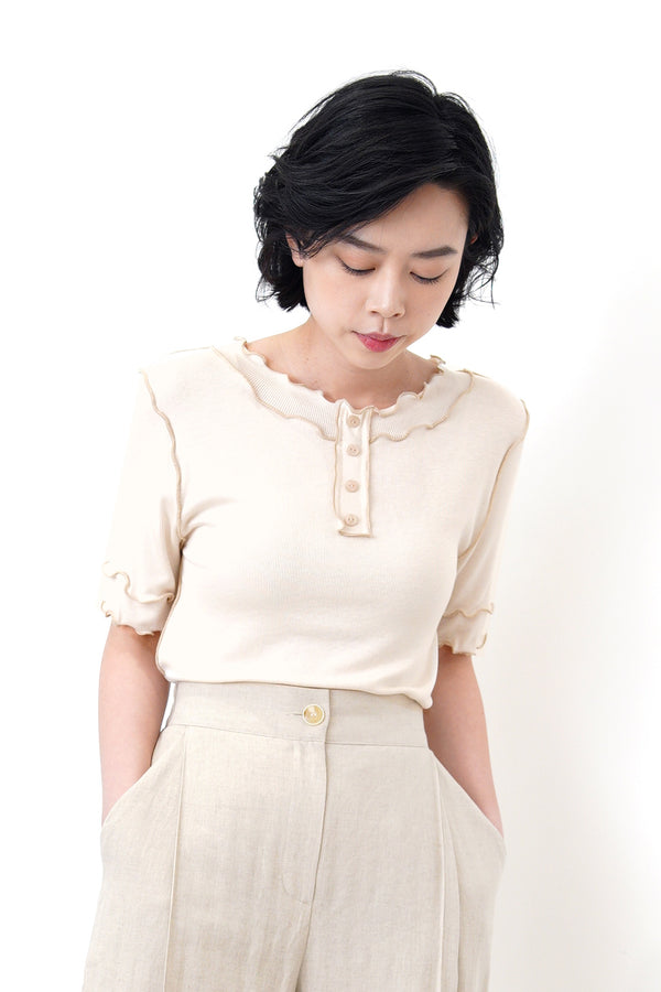 Nude outlined details button top