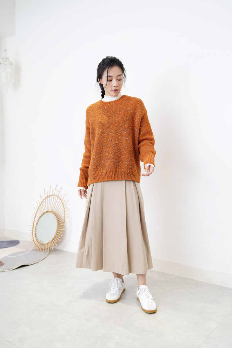 Orange tone sweater in stepped hem