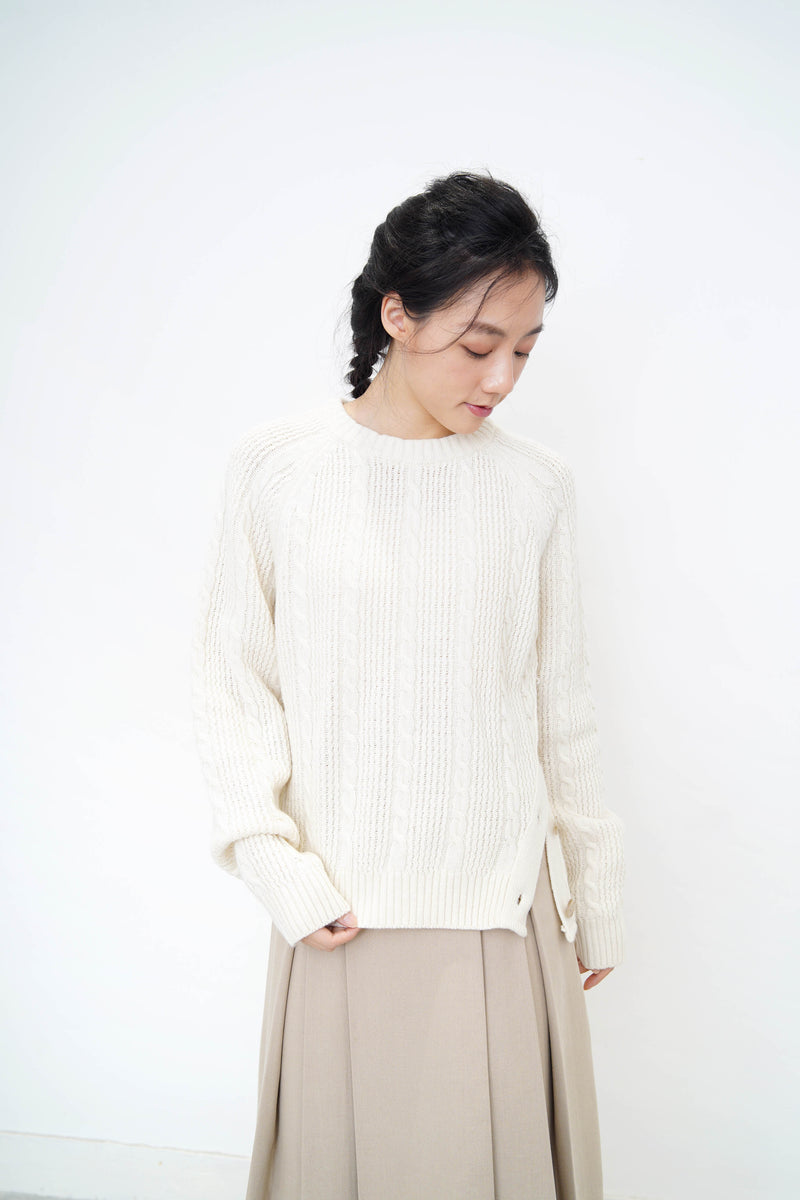 Ivory twist pattern sweater w/ side vent buttons