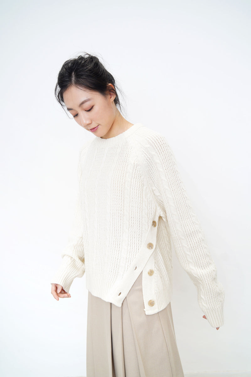 Ivory twist pattern sweater w/ side vent buttons