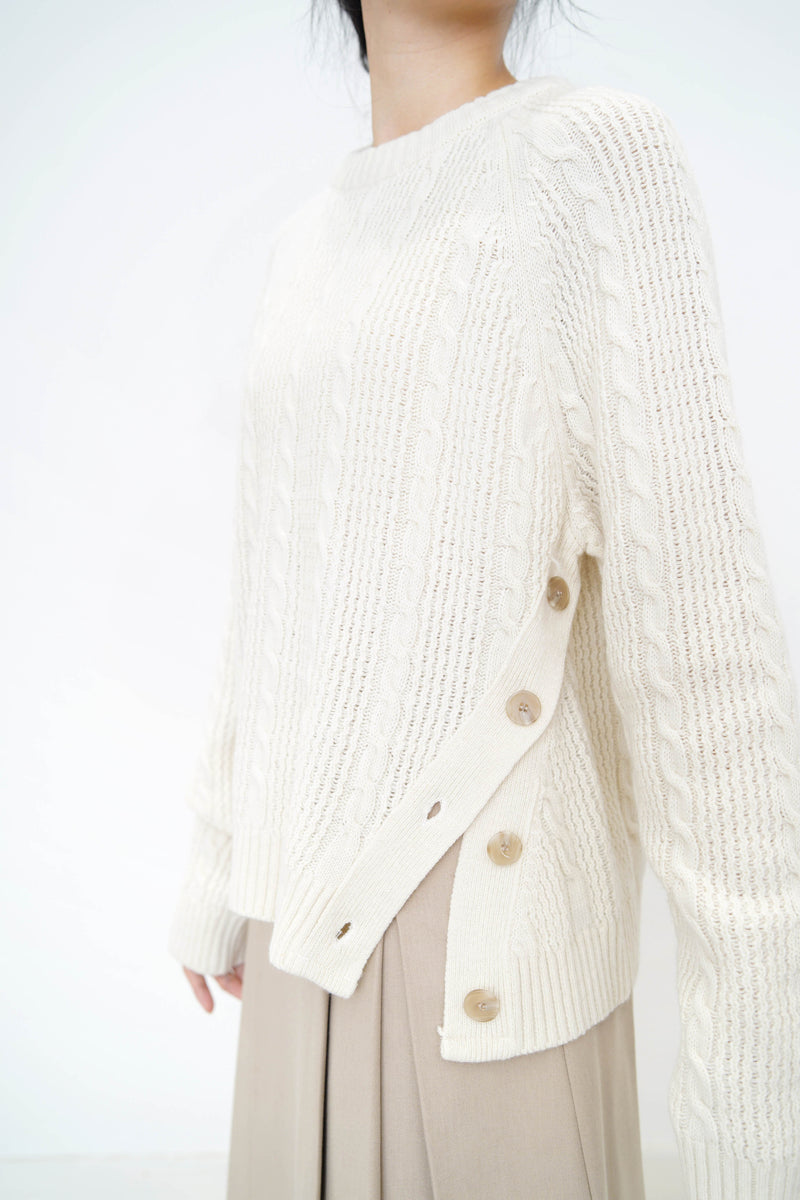 Ivory twist pattern sweater w/ side vent buttons