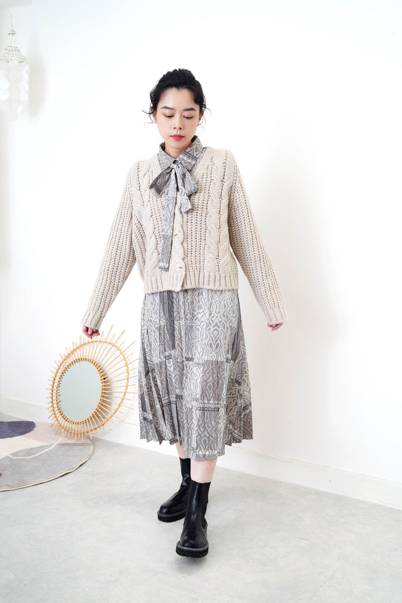 Grey wool cardigan in twist details pattern