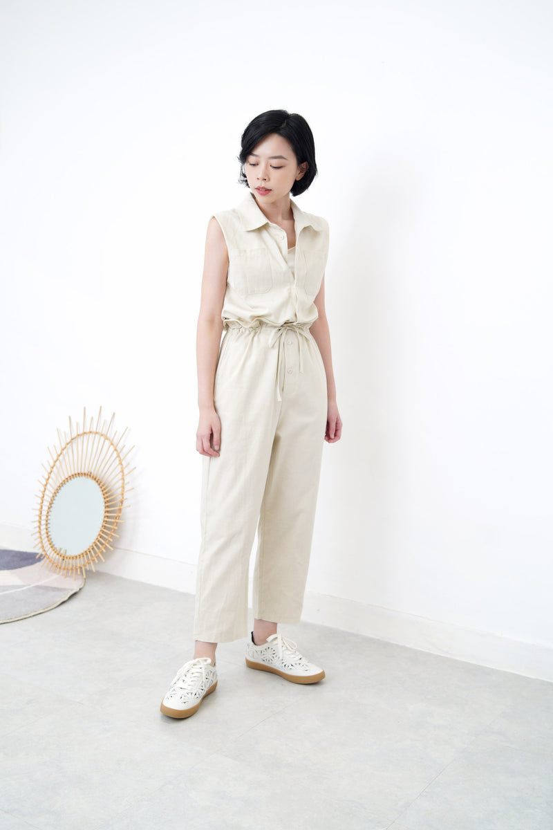 Beige overall w/ frill waist details