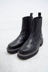 Black outlined chunky chelsea boots