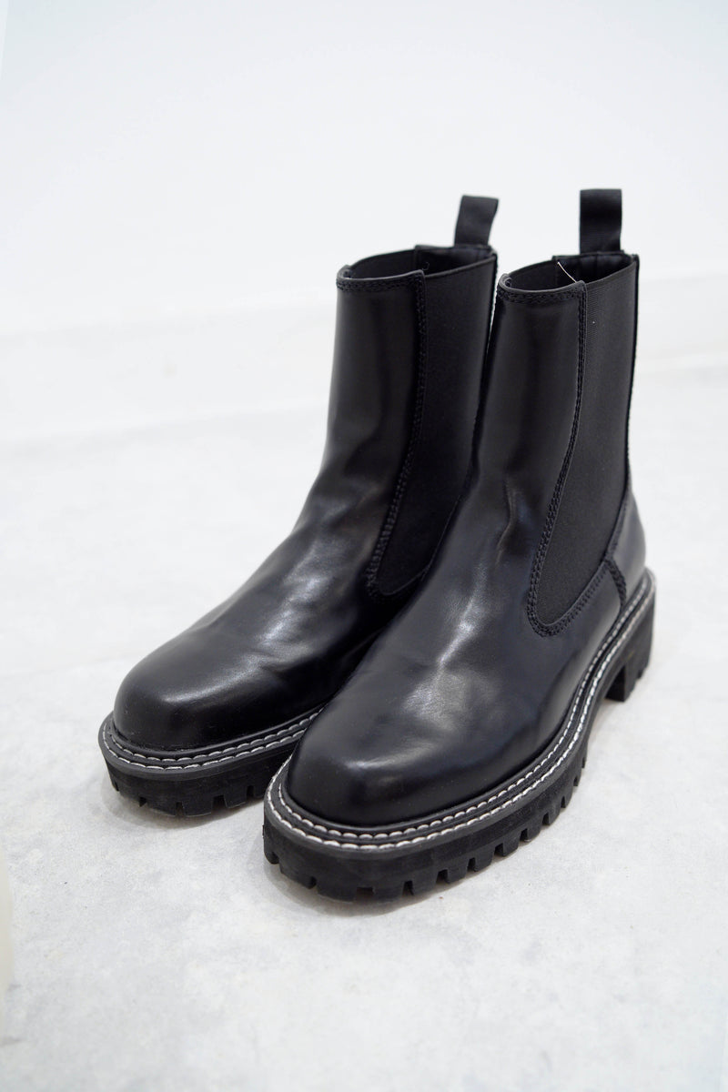 Black outlined chunky chelsea boots