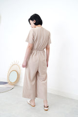 Beige v neck jumpsuit w/ side waist strings