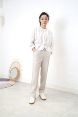 White linen blouse in peplum hem