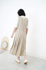 Beige v neck one piece in pleats