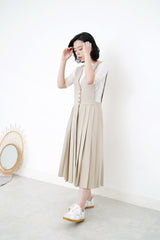 Beige v neck one piece in pleats