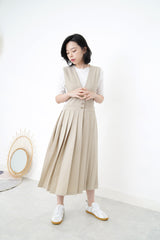 Beige v neck one piece in pleats