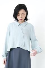 Baby blue crop blouse in asymmetric buttons