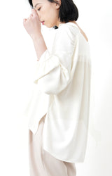 Ivory loose cut blouse in stepped hem