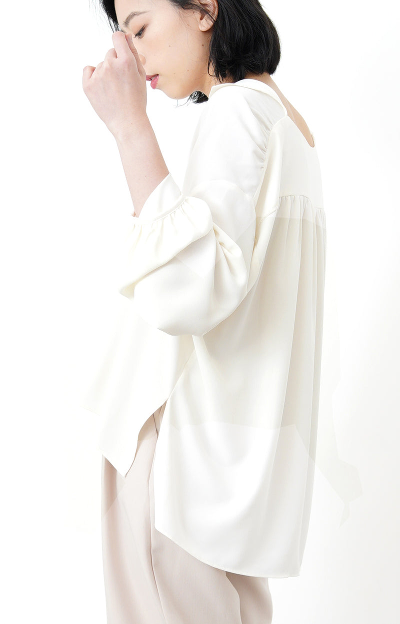 Ivory loose cut blouse in stepped hem