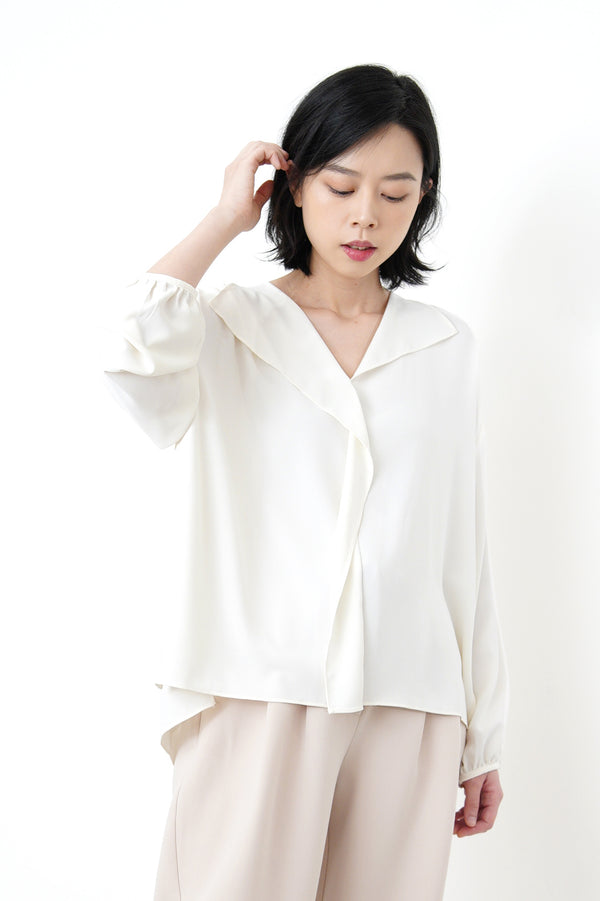 Ivory loose cut blouse in stepped hem