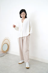 Ivory loose cut blouse in stepped hem