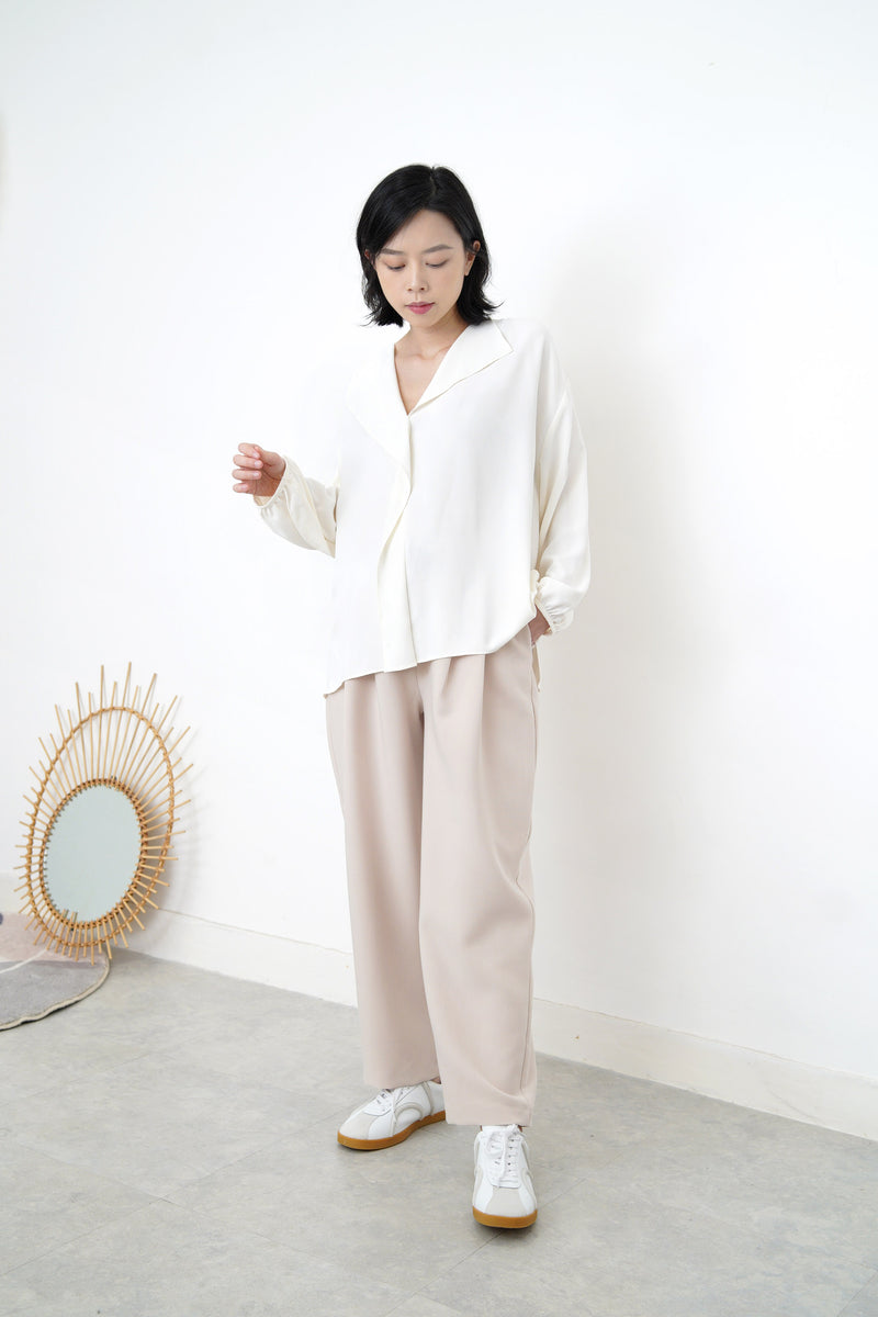 Ivory loose cut blouse in stepped hem