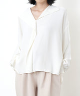 Ivory loose cut blouse in stepped hem