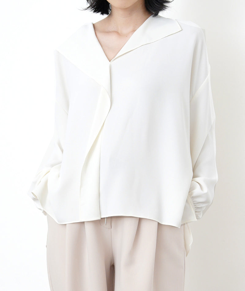 Ivory loose cut blouse in stepped hem