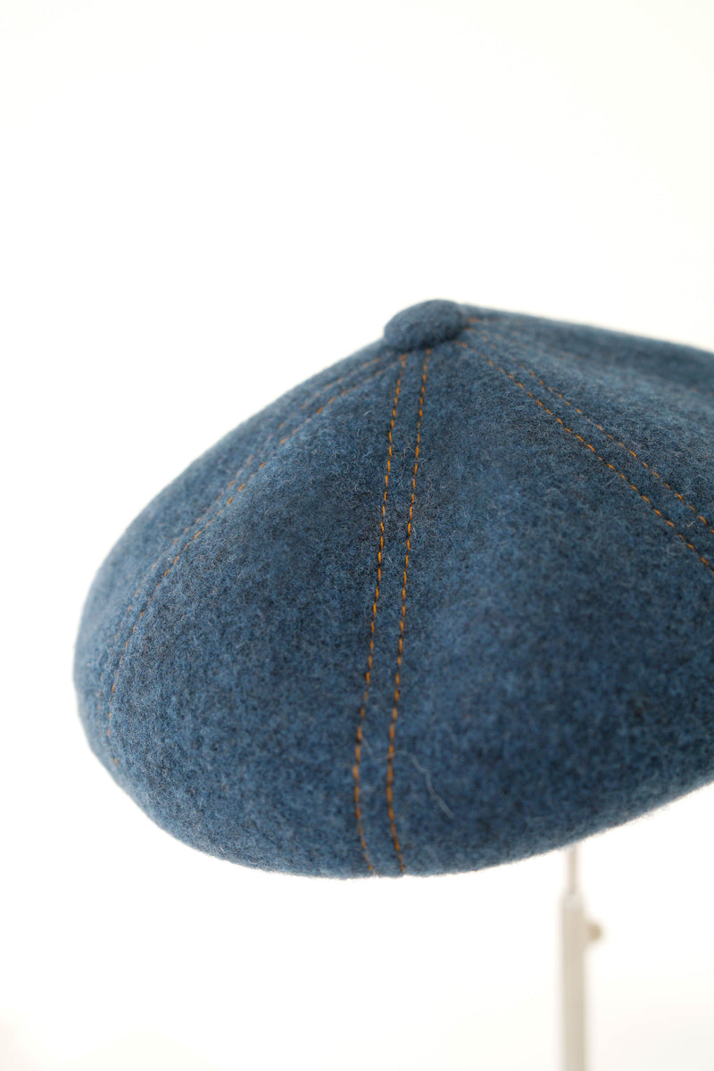 Blue beret in outline stitching