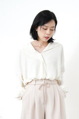 Ivory loose cut blouse in stepped hem