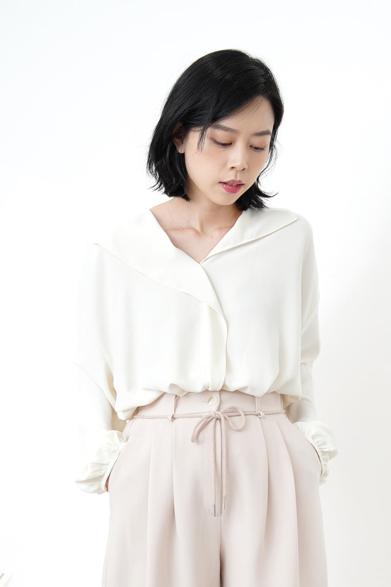 Ivory loose cut blouse in stepped hem
