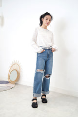 Blue denim wide leg jeans in ripped details