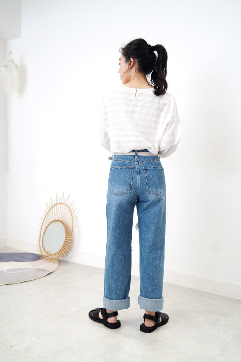 Blue denim wide leg jeans in ripped details