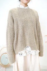 Beige smooth sweater in cut out hem