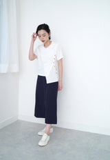 White tee top w/ asy. button details