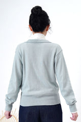 Light blue knit top in overlap v neck cut