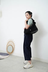 Black texture shoulder bag in elastic handle