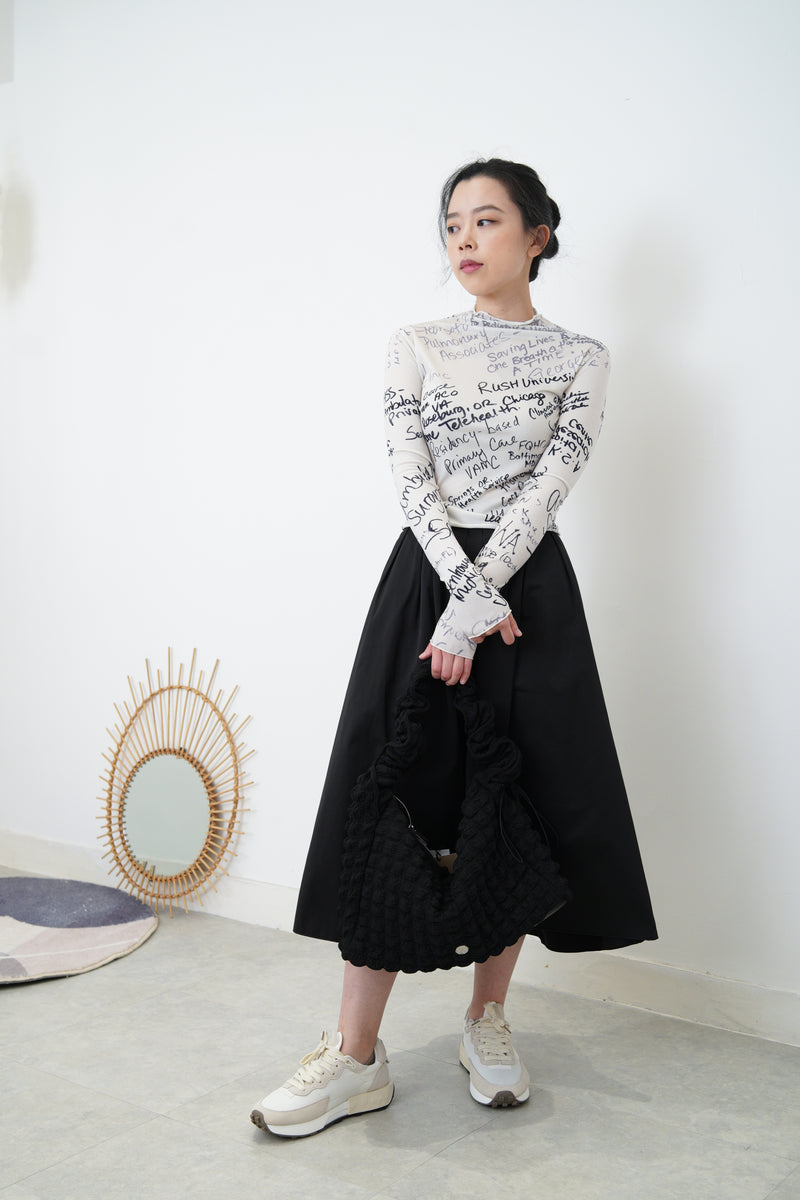 White top w/ hand written pattern