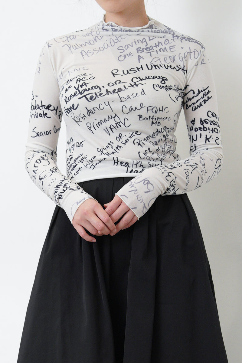 White top w/ hand written pattern