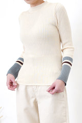 Beige knit top w/ contrast color sleeves