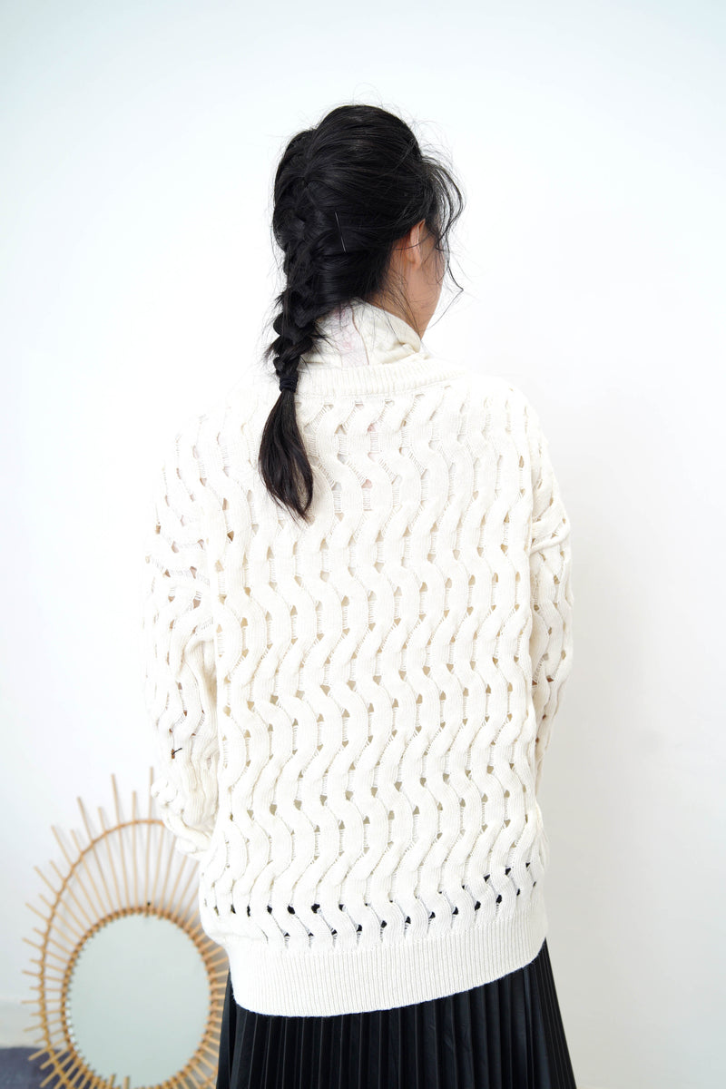 Ivory sweater in wavy crochet pattern