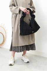 Black texture shoulder bag in elastic handle