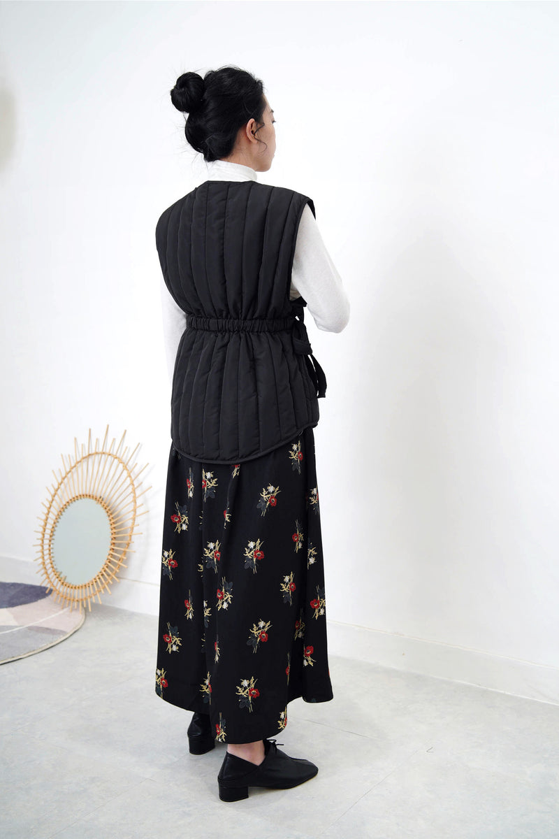 Black quilted vest jacket with waist strap