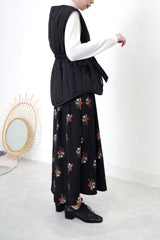 Black quilted vest jacket with waist strap