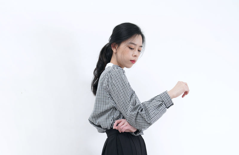 Check blouse in detail stand collar