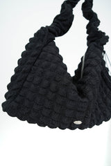 Black texture shoulder bag in elastic handle