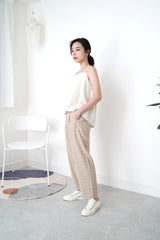Beige checked trousers in waist detail
