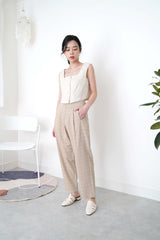 Beige checked trousers in waist detail
