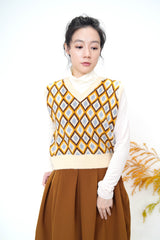 Beige v neck vest in diamond pattern