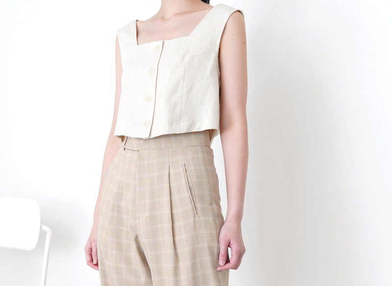 Beige checked trousers in waist detail