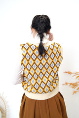 Beige v neck vest in diamond pattern