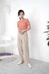 Beige checked trousers in waist detail