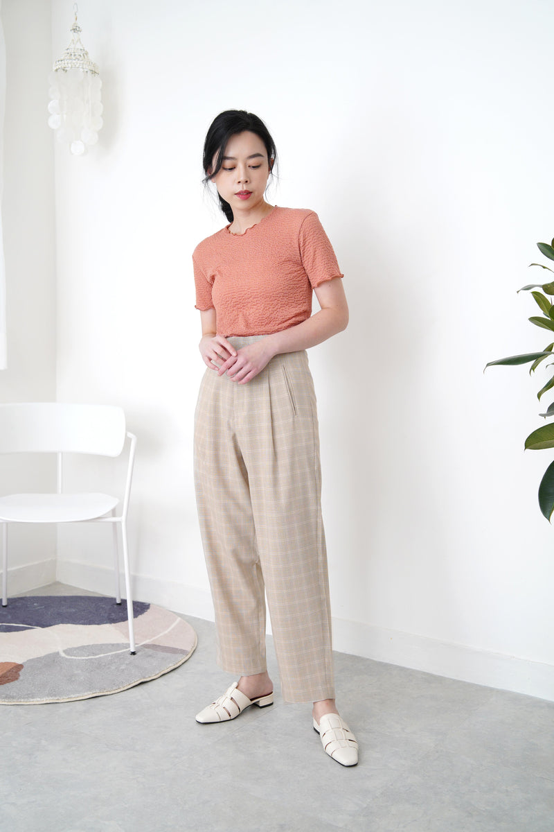 Beige checked trousers in waist detail