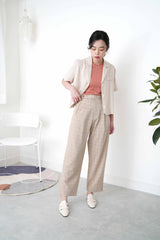Beige checked trousers in waist detail