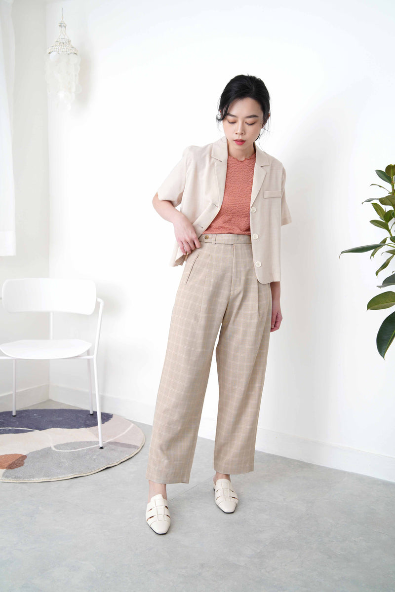 Beige checked trousers in waist detail